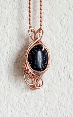 small oval pendant - 3 black goldstone